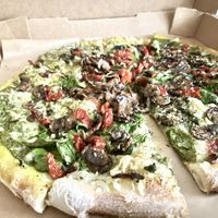 Vegan cheese, basil pesto sauce, garlic, oregano,  basil, sun dried tomatoes, mushrooms   at Your Pie in Houston