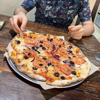 Vegan cheese, tomato, red onion and black olive pizza  at Your Pie in Houston