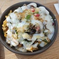 VEGAN PALAK PATTA CHAAT: Crispy & fried battered spinach leaves, Mint, tamarind & vegan yogurt at Delhi House Cafe in Manchester