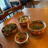 Dabha Aloo Gobhi and Sanskari Khichidi  with Basmati Rice, and a bowl of vegan yoghurt. at 5Tara in Sheffield