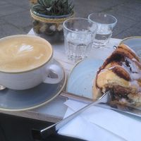 Large cappuccino with oat milk and a cinnamon roll at Herr Liebig Kaffeehaus in Dortmund
