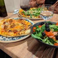 Half-vegan chorizo pizza with salad at Bella Vita in Strasbourg