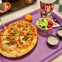 Vegetable Pizza made with Vegan Cheese, side house salad with plant based ranch at Walt Disney World - PizzeRizzo in Lake Buena Vista
