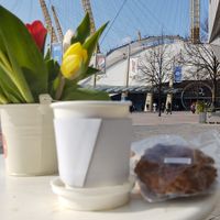 Coffee and cookie with the O2 in the background  at Manna Eating - Pop up in South East London