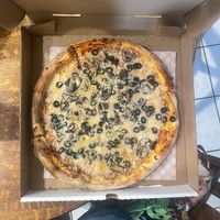 i added follow your heart parmesan cheese, the pizza will look slightly different without this added cheese   at Uncle Gino's Pizzeria in Temecula