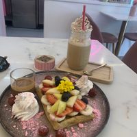 Vegan waffle with fruits and Lotus buiscuit topping; vegan frappe with caramel an cream  at Anita Cakes in Mallorca