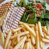 Cheese/chutney panini, salad & fries. at Huggers in Norwich