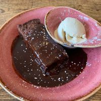 Warm chocolate fudge cake with vanilla icecream ❤️ at Huggers in Norwich
