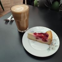 Oat latte and raspberry cheesecake at Kafe Hummusson - 2nd Floor in Malmo