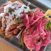 Spicy jackfruit carnitas with watermelon and the fried squash blossom with vegan Chihuahua cheese at Tacos Tu Madre - Westwood in Los Angeles