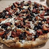 Pizza Urraca (tomatoes, vegan mozzarella, vegan meat, olives, walnuts) at Monkey in Gran Canaria