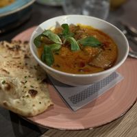 Eggplant curry with garlic naan  at Ginti and More in Cologne