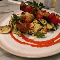 Amba chick’n kebabs - Mango marinated plant chick’n, saffron courgette orzo,
tomato red chilli shatta at Mildreds - Covent Garden in London