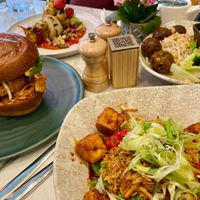 Tempeh ball dish, korean fried chick'n burger, a kebab dish, and a tofu dish at Mildreds - Covent Garden in London