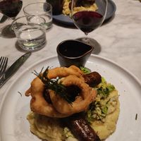 Sausages, mash, cabbage, gravy and onion rings. at Mildreds - Covent Garden in London