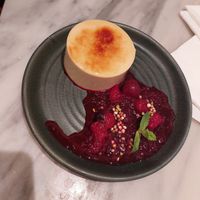 'crème brulee' - vanilla custard, morello cherry compote, pistachio puffed quinoa ($8) at Mildreds - Covent Garden in London