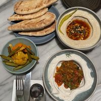 Taste of Mildred’s menu: Rainbow pickles, taktouka whipped mascarpone, salsa macha hummus & pita.  at Mildreds - Covent Garden in London