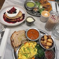 Full English breakfast (bottom), berries and cream pancakes (left), mananero brunch (top)  at Mildreds - Covent Garden in London