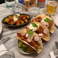 Harissa Patatas Bravas (background) and Chipotle Chick+n Tinga Tacos (foreground) at Mildreds - Covent Garden in London