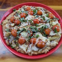 Custom Pizza: 10", Whole Grain Beer Crust, Black Bean Sauce, Vegan Cheese, Artichoke Hearts, Basil, Cherry Tomatoes, Red Pepper Flakes #Veganuary at Pizza Port - Solana Beach in Solana Beach