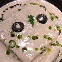 Layers of veggies, covered with pasta sheet, moringa & creamy cashew sause at Vegan Vogue in Bangalore