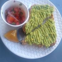 Avocado toast with pico de gallo at Marea Surf Shop Cafe in Samara