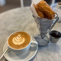 Churros con chocolate + Cappuccino (only on weekends in winter) at Vrote in Montevideo