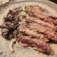 Caesar salad with redefine meat and la-feta burger at Alpaca Bar in Tel Aviv