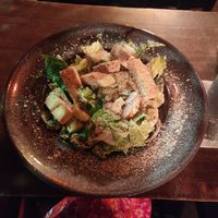 caesar salad with tofu! beware of the onions 😈 at Alpaca Bar in Tel Aviv