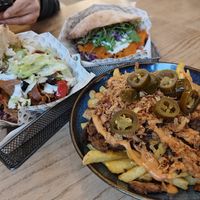 Clockwise, from the bottom: Loaded fries (Amazing, they have a kick!) + Veganitas Berlin K'Bab (super filling and well balanced taste!) + The Wood Smoked Salm'N (unique taste). at Veganitas in Zurich