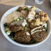 Best meal I’ve had in the Keys! Fried cauliflower, falafel, cucumbers, onions, lettuce, hummus. Our waitress was super cool and friendly, and was also vegan which was exciting.  at Meze Morada in Islamorada