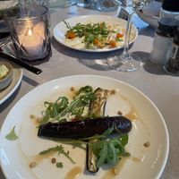 Cold aubergine dish, celeriac carpaccio in the background   at Rozey in Amersfoort