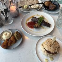 Slider / mini burger, pakora, fried eggplant, flatbread with hummus, potatoes, asparaguss  at Rozey in Amersfoort