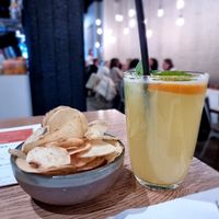 Drinks and salted crisps at NOMAD in Bruges