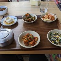 All vegan banchan selection, with rice and house-made tofu at Joodooboo in Oakland