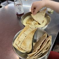 Little one about to dip into some hummuss  at Plantamientos in Madrid