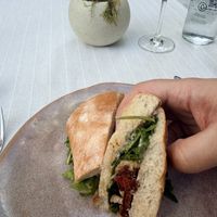 Ciabatta, roasted tomatoes, mushrooms, arugula and cashew cheese spread.  at Gioia Cocina Botánica in Buenos Aires