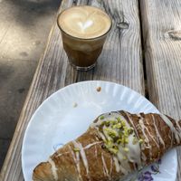 Croissant filled with pistachios and flat white   at Hempies - Händelstraße in Cologne