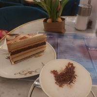 nougat marzipan cake and oat milk cappuccino at Cafe Geissner in Giessen