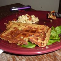 Cinnamon raisin waffles, sun dried tomato basil tofu, spinach tomato salad, black beans at Vegeria - Viva Book Complex in San Antonio