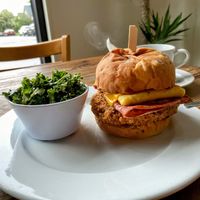 Fried Soy Chicken Bfast Burger with kale side salad  at Rabbits Cafe - Killingsworth in Portland