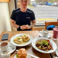 Bright window seating on a gloomy day.   at Rabbits Cafe - Killingsworth in Portland