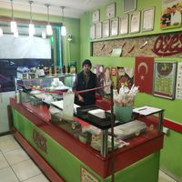 The open kitchen, with tables to eat in. at Oses Cig Kofte in Konya