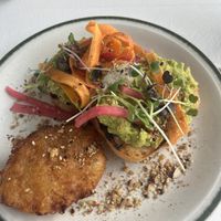 smashed avocado on sourdough + potato hash  at Kinsfolk in Rockhampton