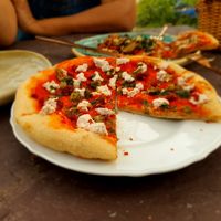 The amazing sourdough pizza with almond ricotta n wild capers. at KaYa Cafe & Guesthouse in Stok