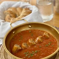 Shakshuka with sausage and side of fresh bagel  at HeyBong - The Healthy Secrets  in Siem Reap