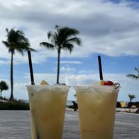 Pineapple coconut drinks from the bar inside. So good!  at Cascades in Nassau