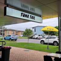 Outdoor seating with a view of the creek at Tuna Tail Poké in Huskisson
