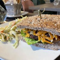 Signature Burger with coleslaw  at Elysian Plant Based Kitchen Bar in Limassol