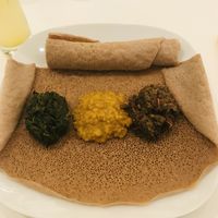 The three stews avec injera   at Vegitopia in Brussels